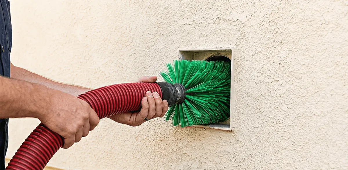 Air duct cleaning brush removing debris from a vent opening in Oakland, CA